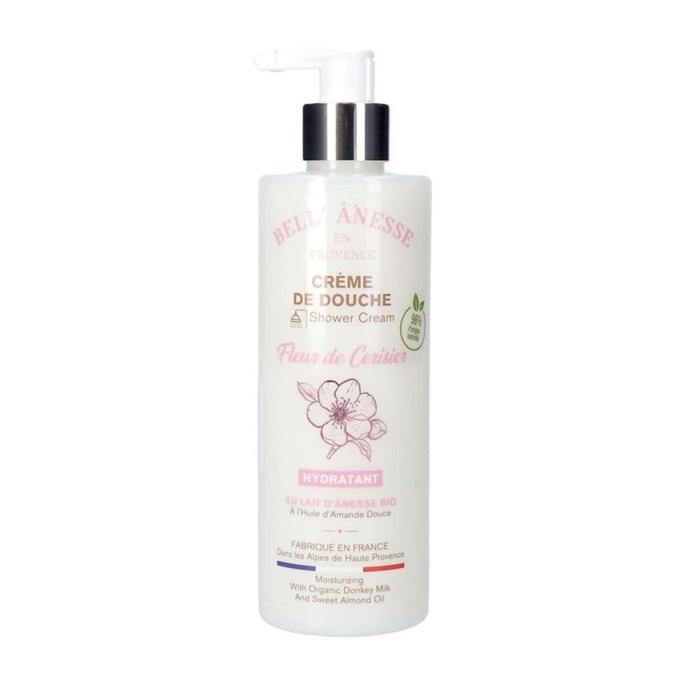 Flacon Crème de Douche. Étiquette blanche, motif fleur rose. Texte: Bell'Ânesse, Crème de Douche, Fleur de Cerisier. Avec pompe.