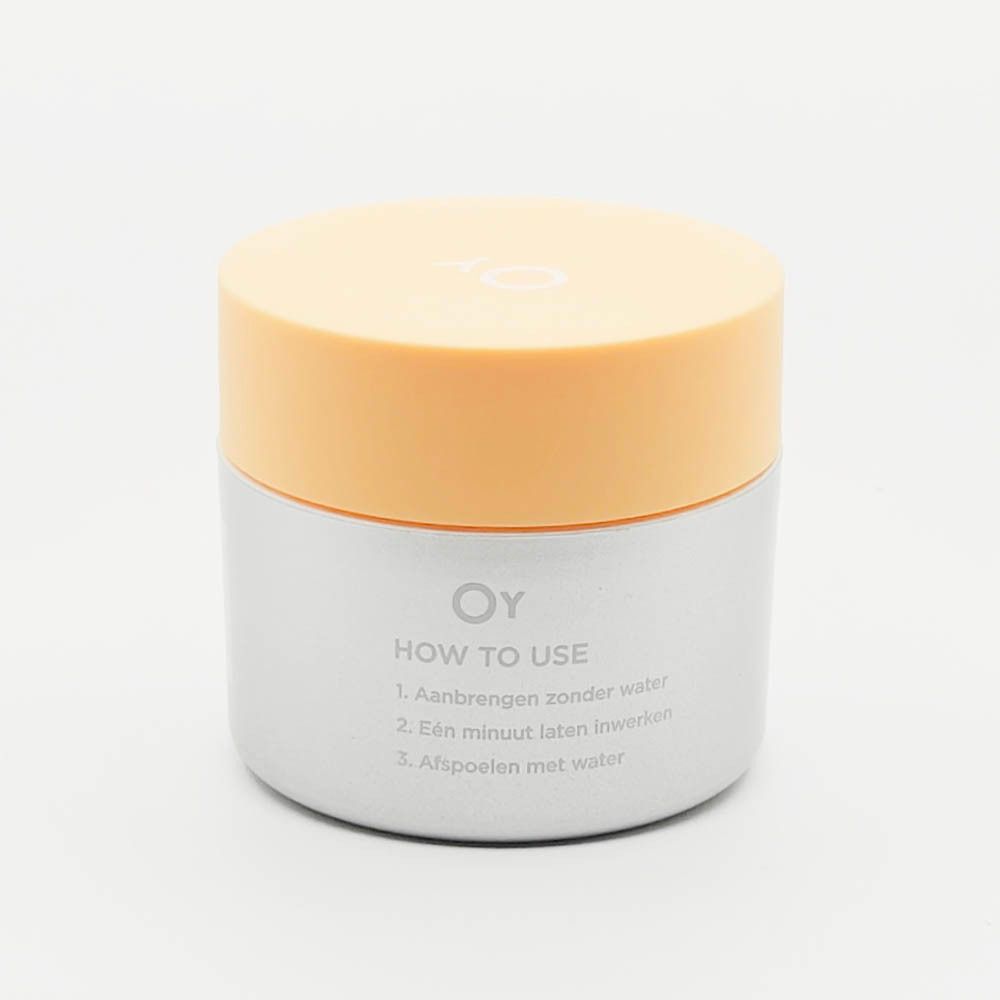 Crèmepot met gele deksel. Opschrift: Oy. Op de zijkant: How to use. 3 gebruiksstappen.