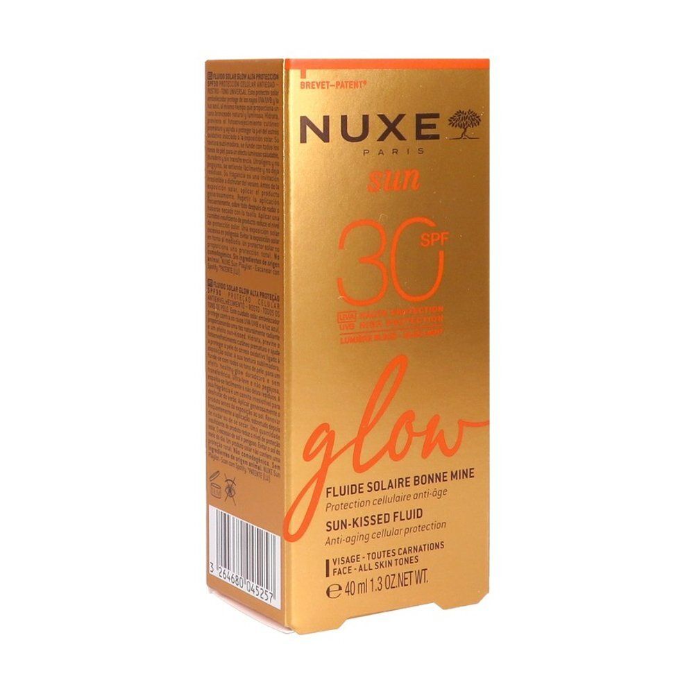 Zijde van de Nuxe Sun zonnefluïde SPF 30 verpakking met applicatiesymbolen en herkomst.