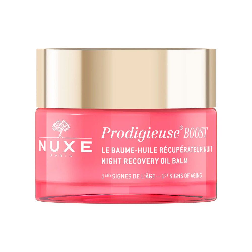 Roze pot met gouden deksel. Opschrift: Nuxe, Prodigieuse Boost, Le Baume-Huile Récupérateur Nuit, 1e tekenen van veroudering.