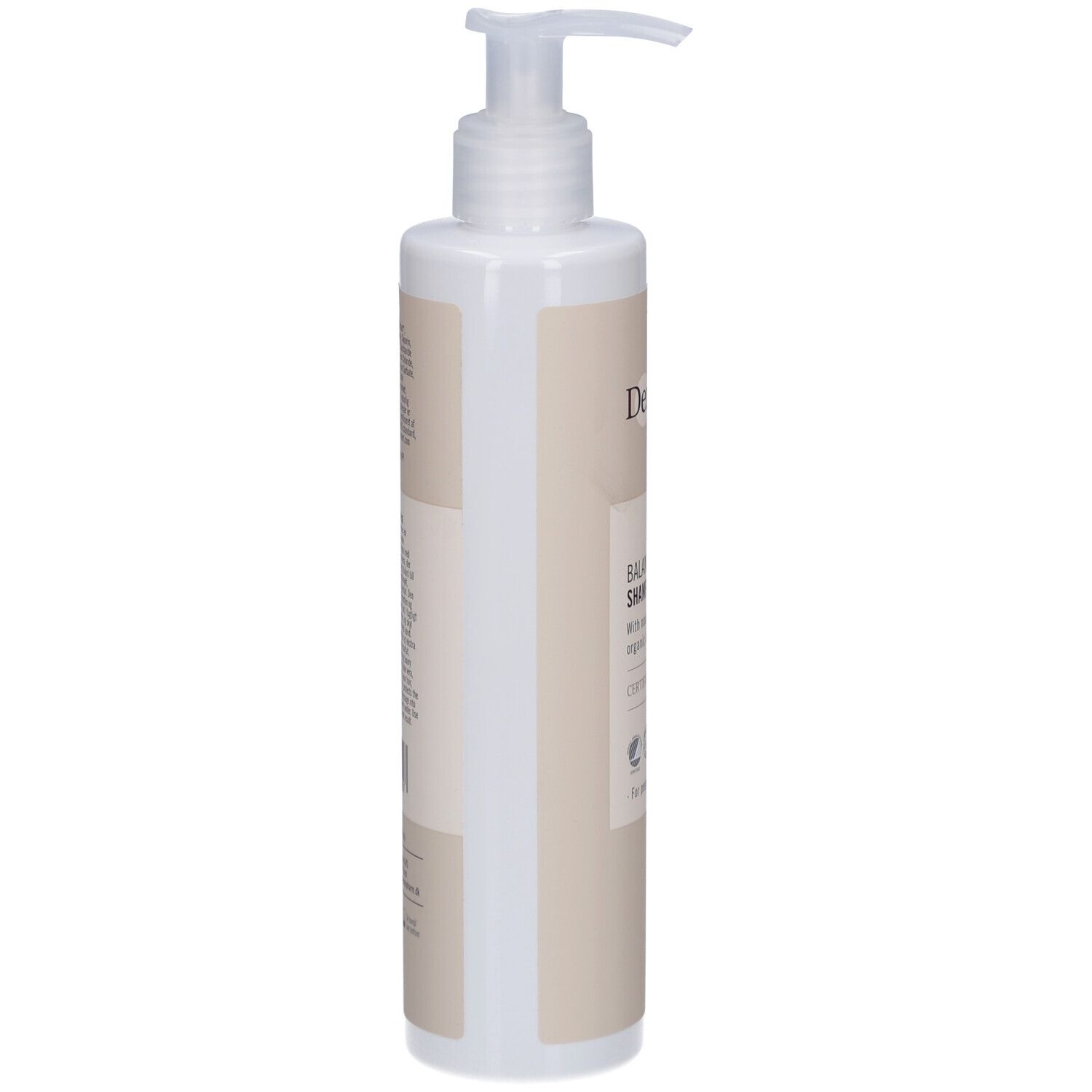 Zijaanzicht van de shampoo fles. Beige fles met witte pomp. Tekst op etiket.