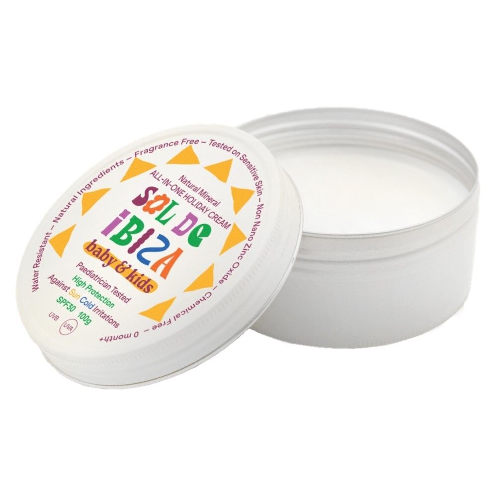 Open witte doos. Opschrift: Sol de Ibiza baby & kids. Tekst in verschillende kleuren. Crème zichtbaar.