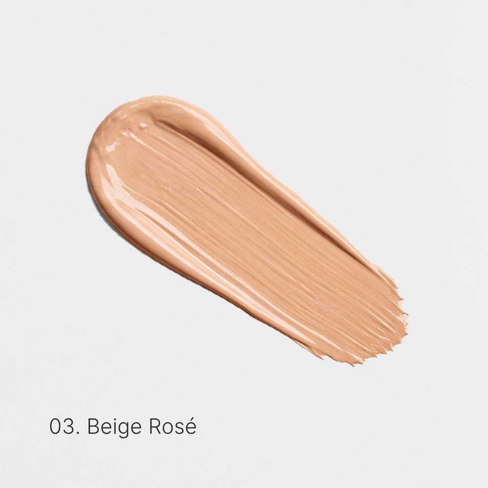 Achterkant van de fles Couleurs de Noir Serum Foundation SPF30 met gebruiksinstructies.