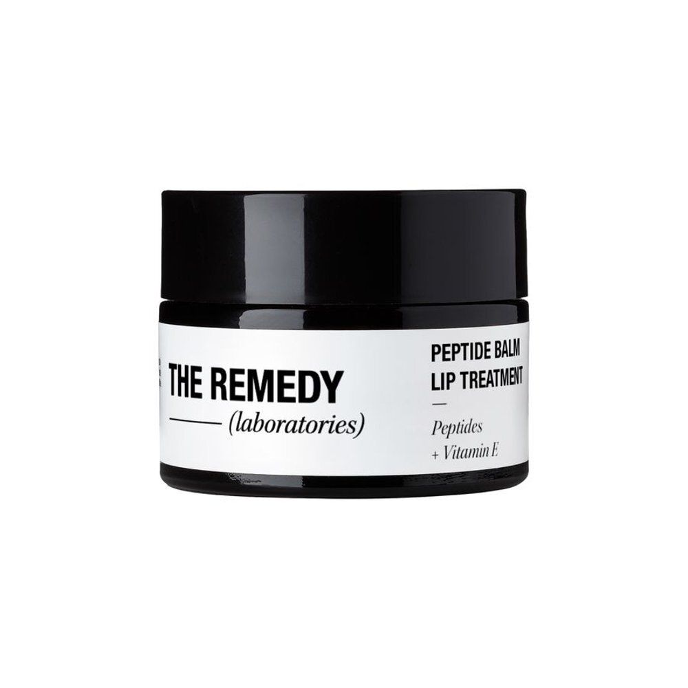 Pot met zwart deksel. Opschrift: PEPTIDE BALM LIP TREATMENT.