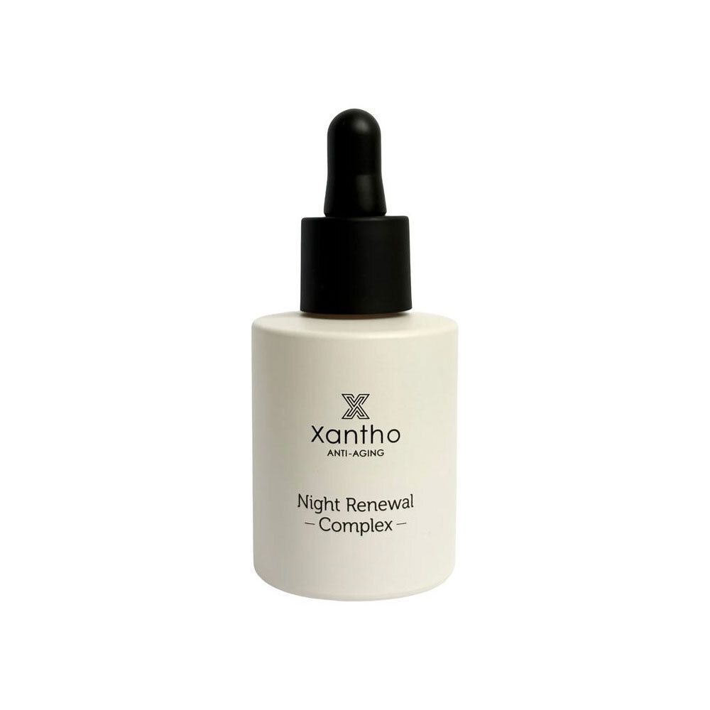 Beige fles met zwarte dop en pipet. Opschrift: Xantho Anti-Aging Night Renewal Complex.