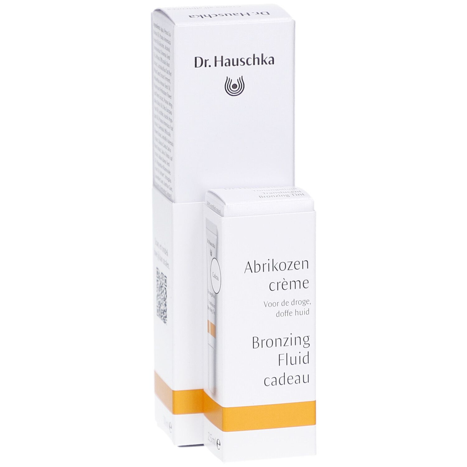 Witte verpakking met productnaam en logo. Bevat een crème en een bronzing fluid. Oranje accent.