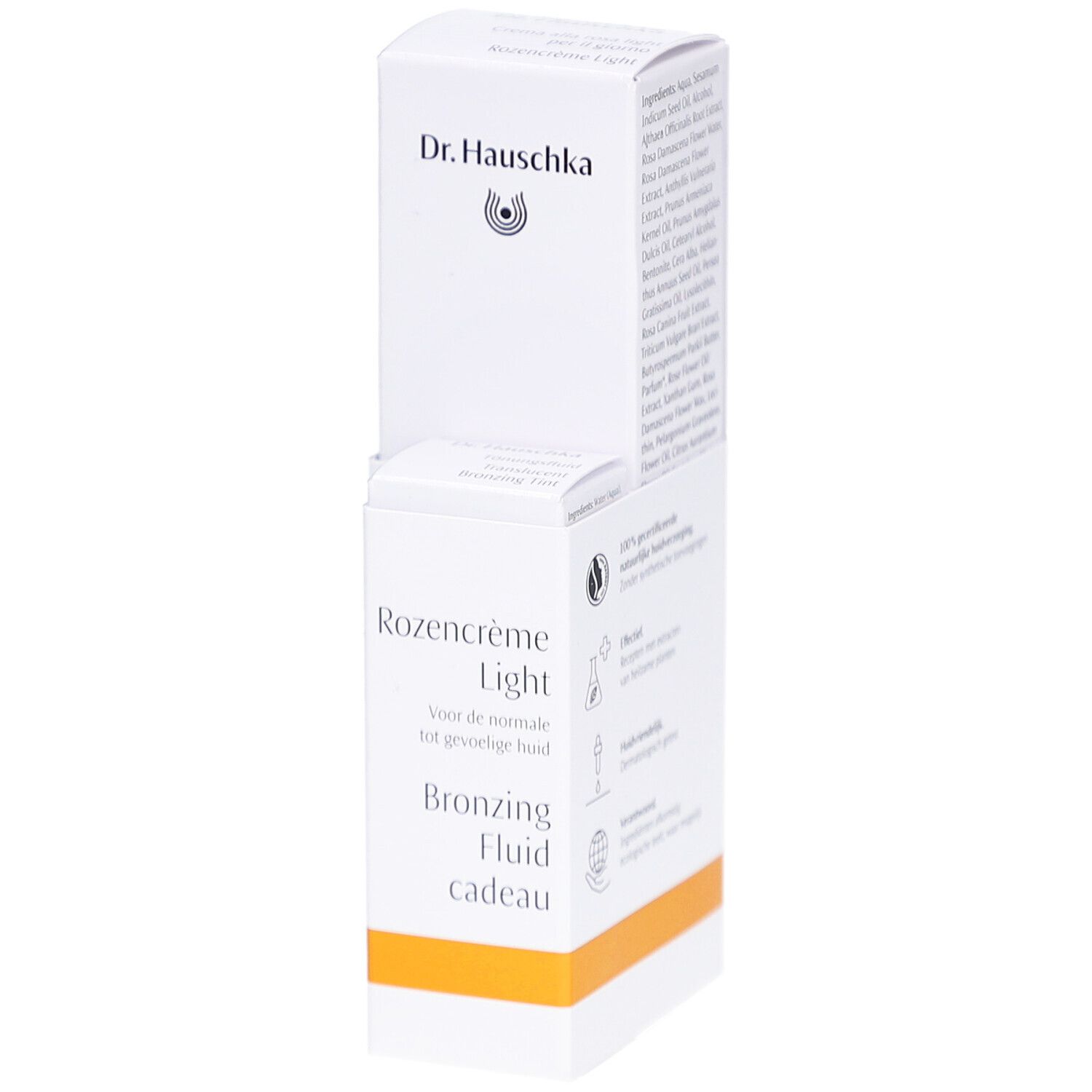 Witte verpakking met productinformatie. Opschrift: Dr. Hauschka, Rozencrème Light, Bronzing Fluid cadeau.