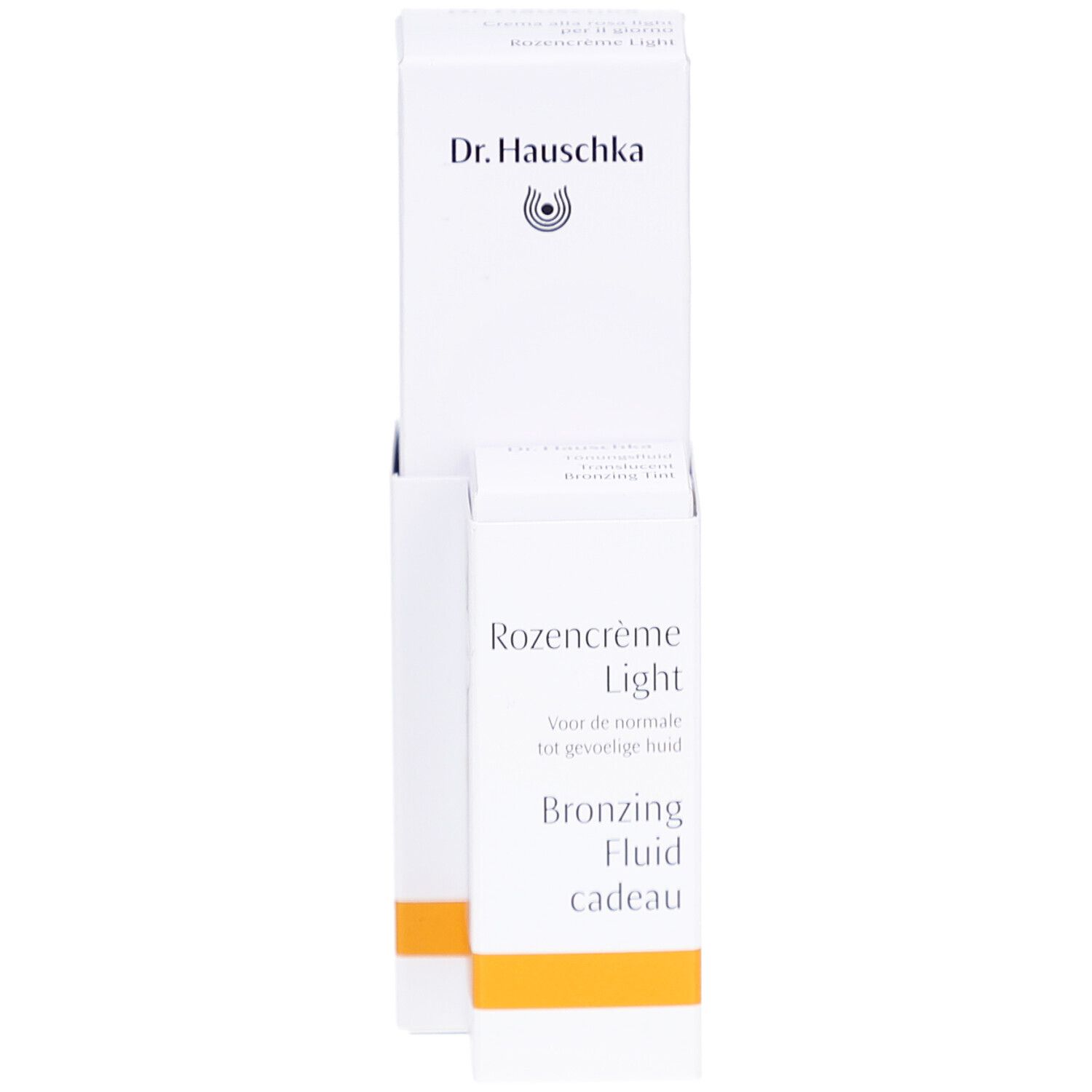 Witte verpakking met product. Opschrift: Dr. Hauschka, Rozencrème Light, Bronzing Fluid cadeau.