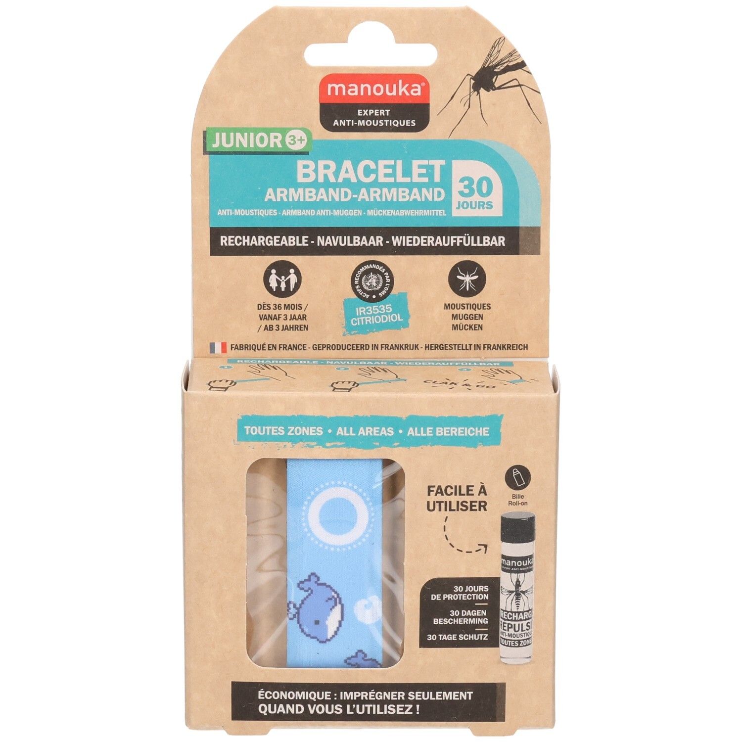 Kartonnen verpakking met blauwe armband en walvismotief. Bevat een navulflesje. Tekst: Manouka, Junior 3+, Bracelet.