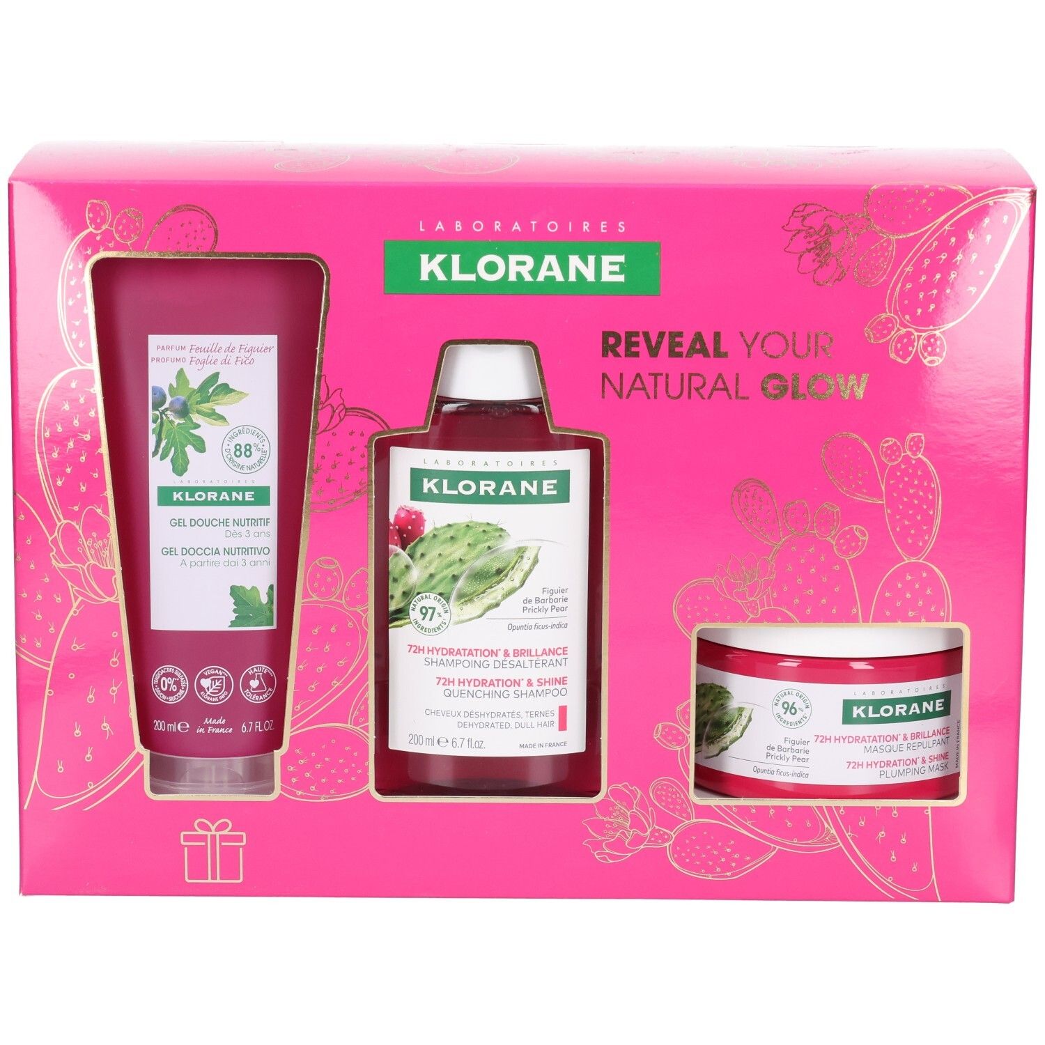 Roze Klorane cadeauverpakking met douchegel, shampoo en crème. Gouden cactus design. Tekst: "Reveal your natural glow".