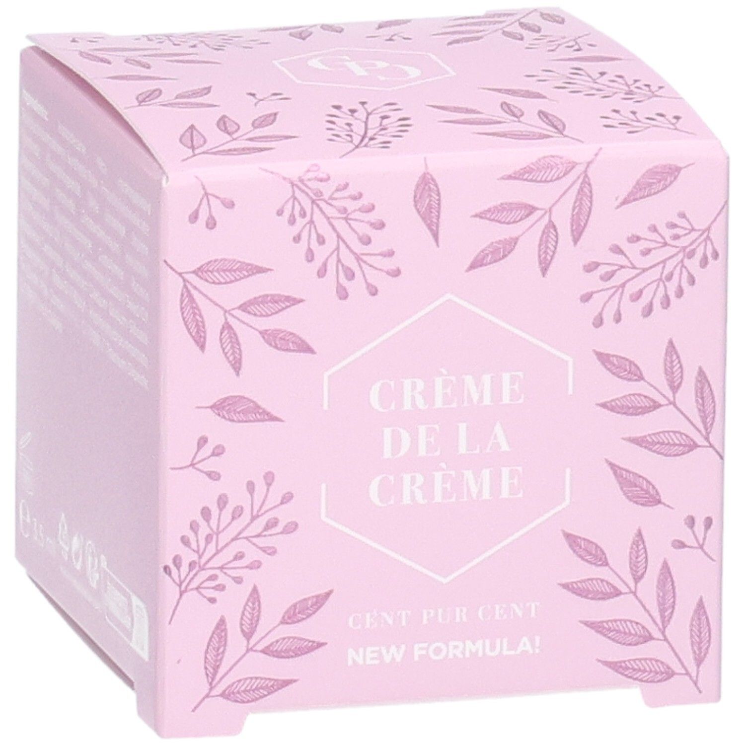Boîte rose avec motif floral. Texte: Crème de la Crème, Cent Pur Cent, New Formula! Taille: 3,5 ml.