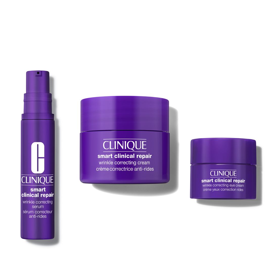 Trois produits Clinique : sérum, crème anti-rides et crème yeux. Pots et flacon violets. Inscription : Clinique Smart Clinical Repair.