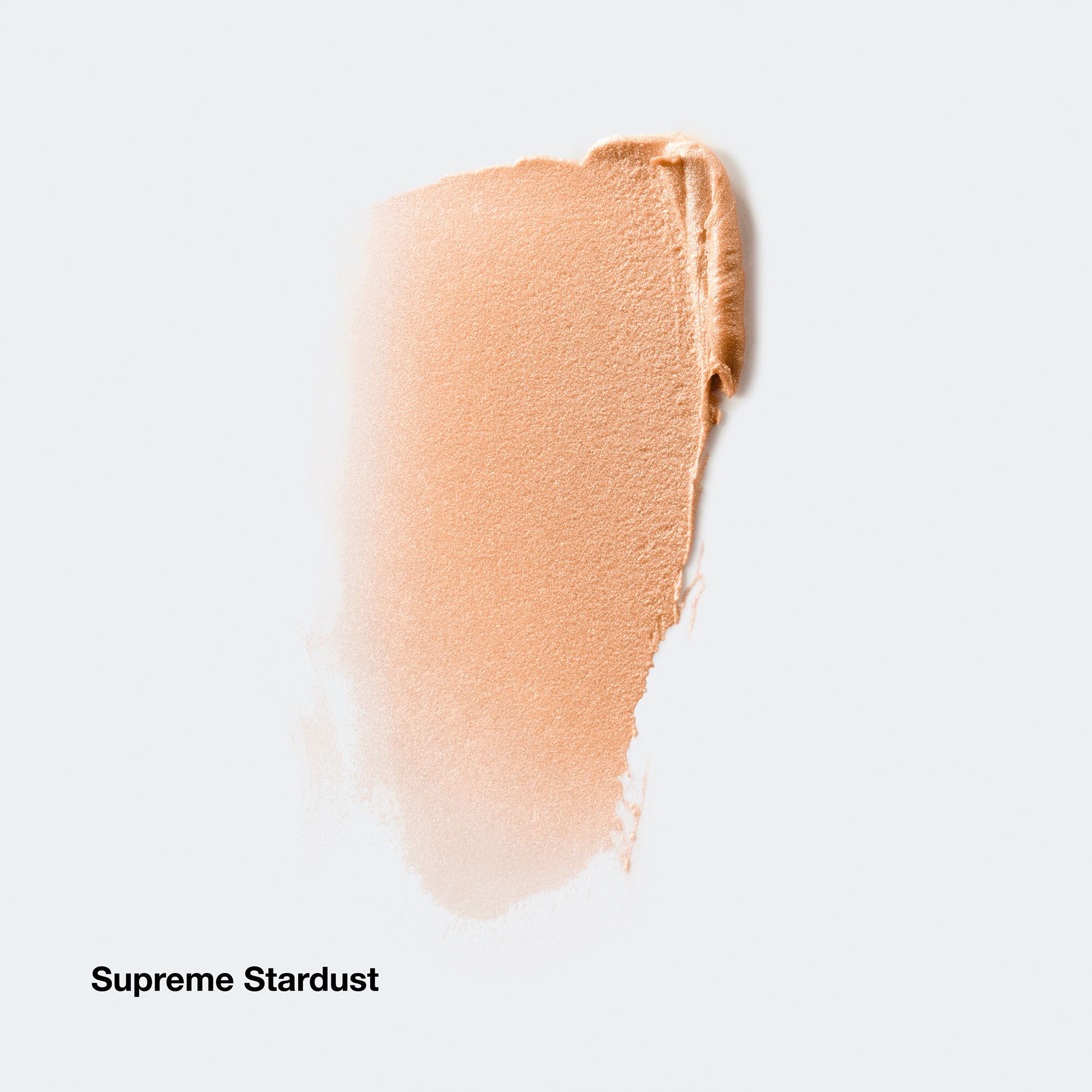 Highlighter Supreme Stardust. Appliqué sur fond blanc. Texture claire et irisée.