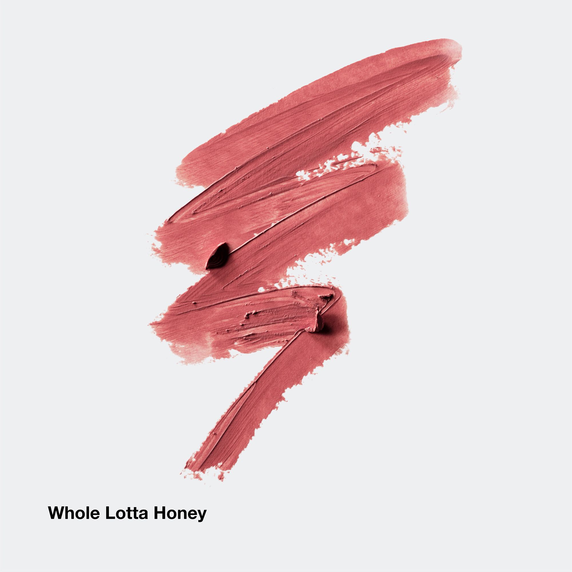 Lippenstift-swatches in bruin. Tekst Whole Lotta Honey onderaan.