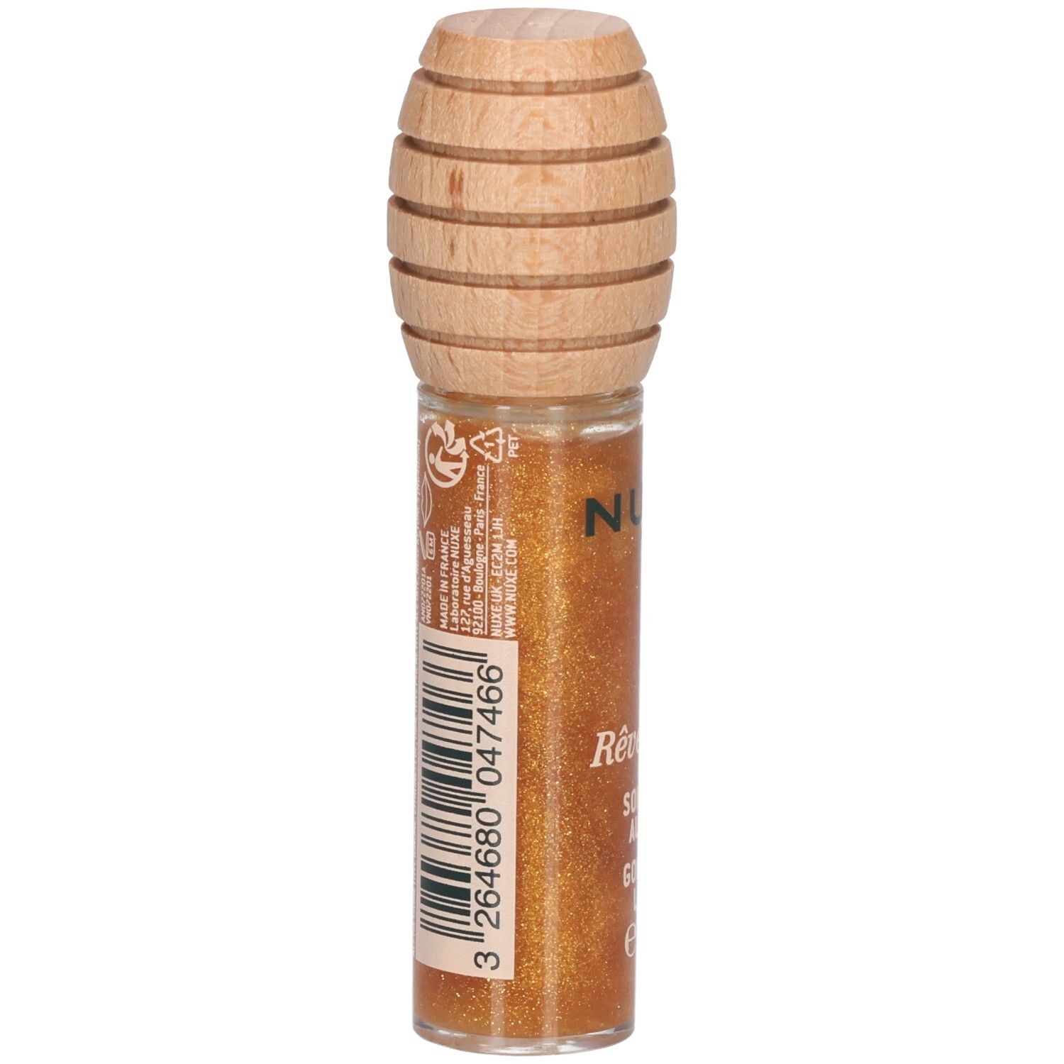 Gouden lipgloss in glazen flesje met houten dop. Achterkant met barcode en tekst. Productnaam: Rêve de miel, Soin Lèvres au Miel Or.
