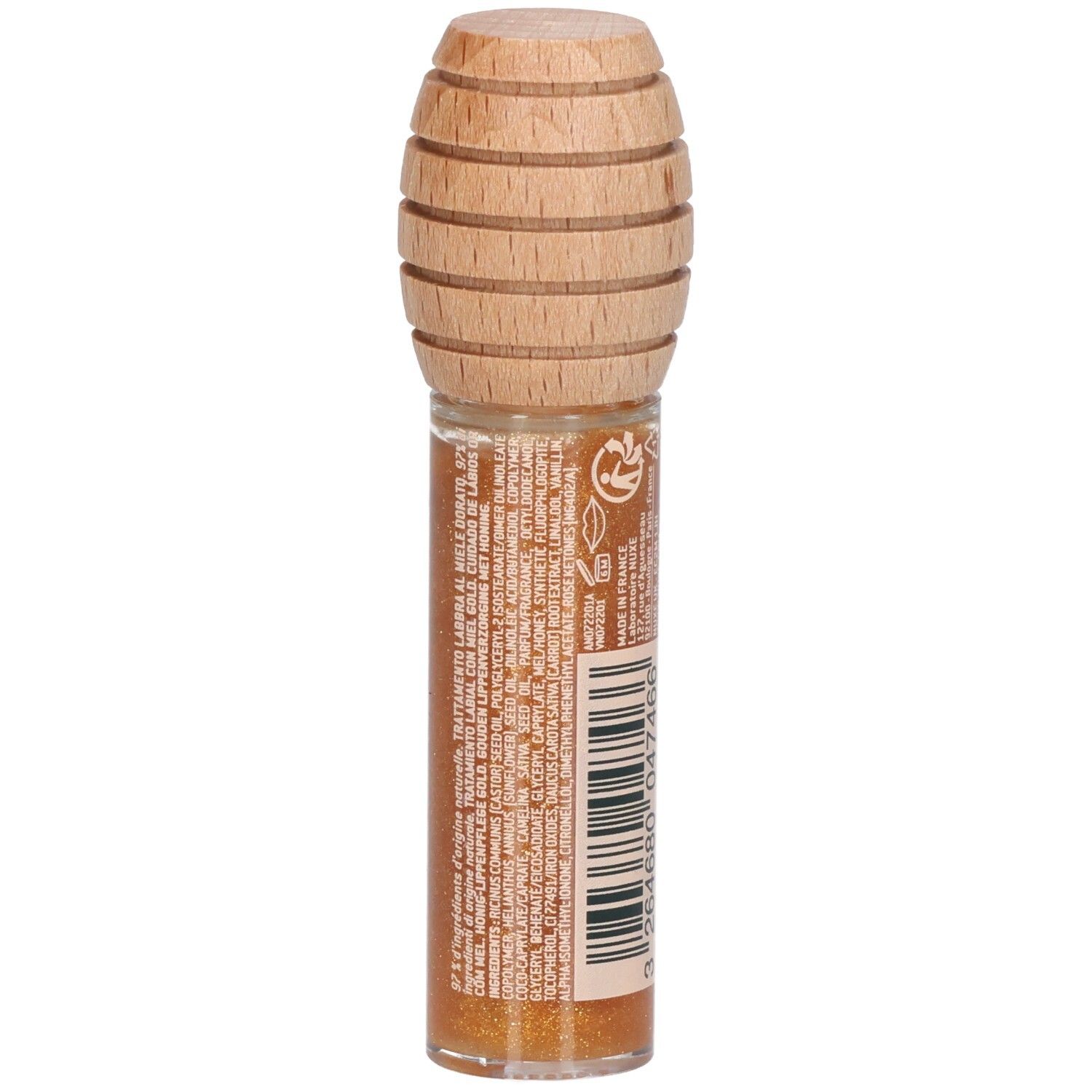 Gouden lipgloss in glazen flesje met houten dop. Achterkant met tekst. Productnaam: Rêve de miel, Soin Lèvres au Miel Or.