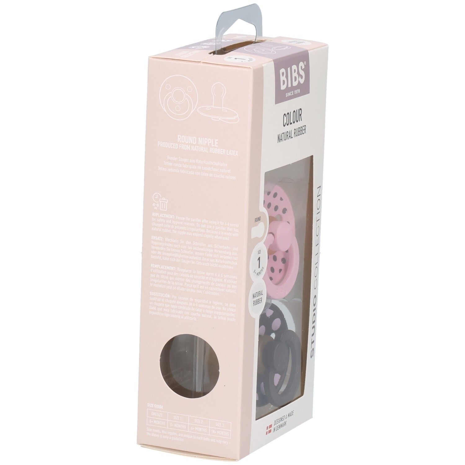 Verpakking met twee fopspenen. Roze en bruin met witte stippen. Merk: BIBS. Transparant venster.