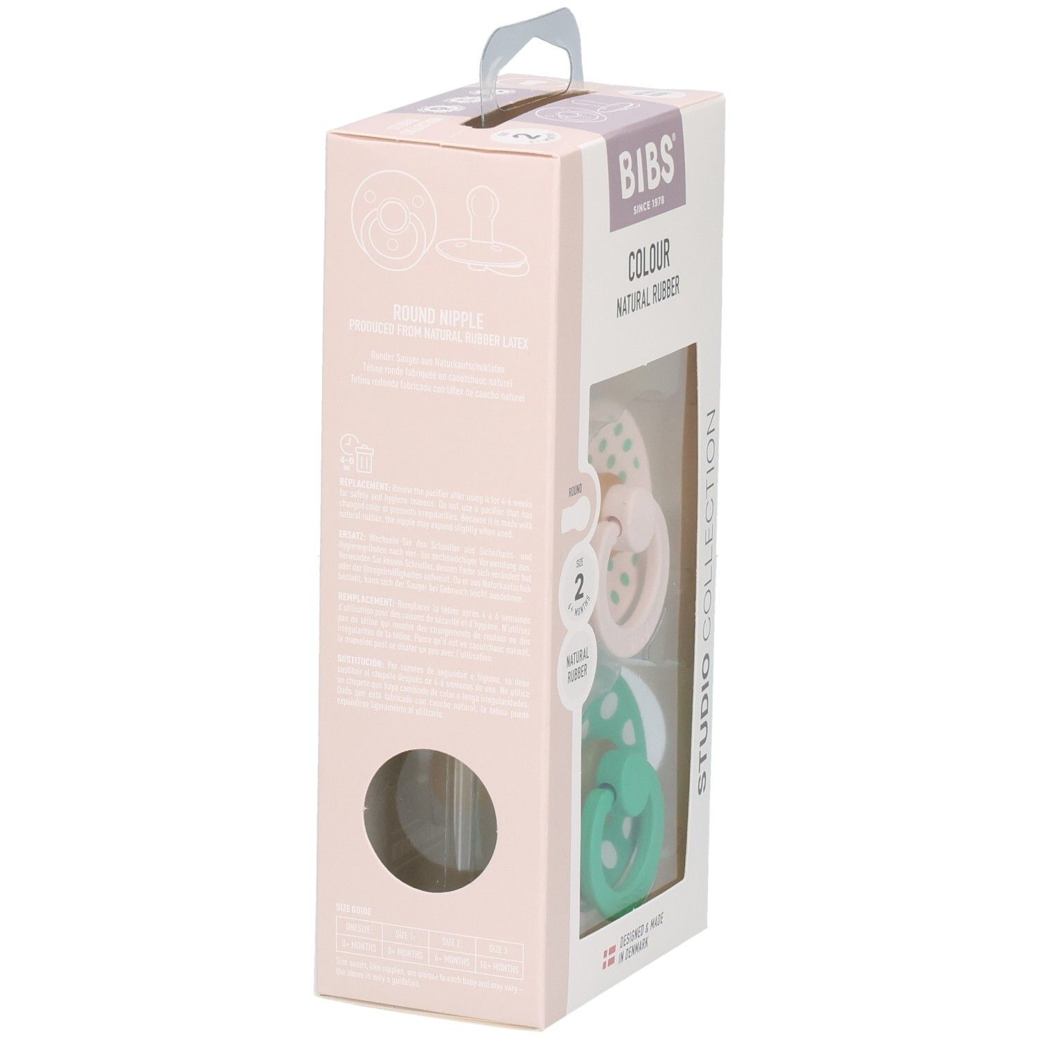 Verpakking met twee fopspenen. Roze en groene spenen met witte stippen. Merk: BIBS. Natuurrubber.