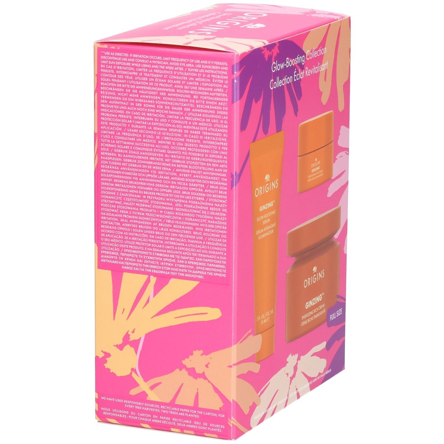 Verpakking van de Origins Glow-Boosting Collection. Tekst op de zijkant. Producten: Ginzing Glow-Boosting Serum, oogcrème, rich cream. Bloemenpatroon.