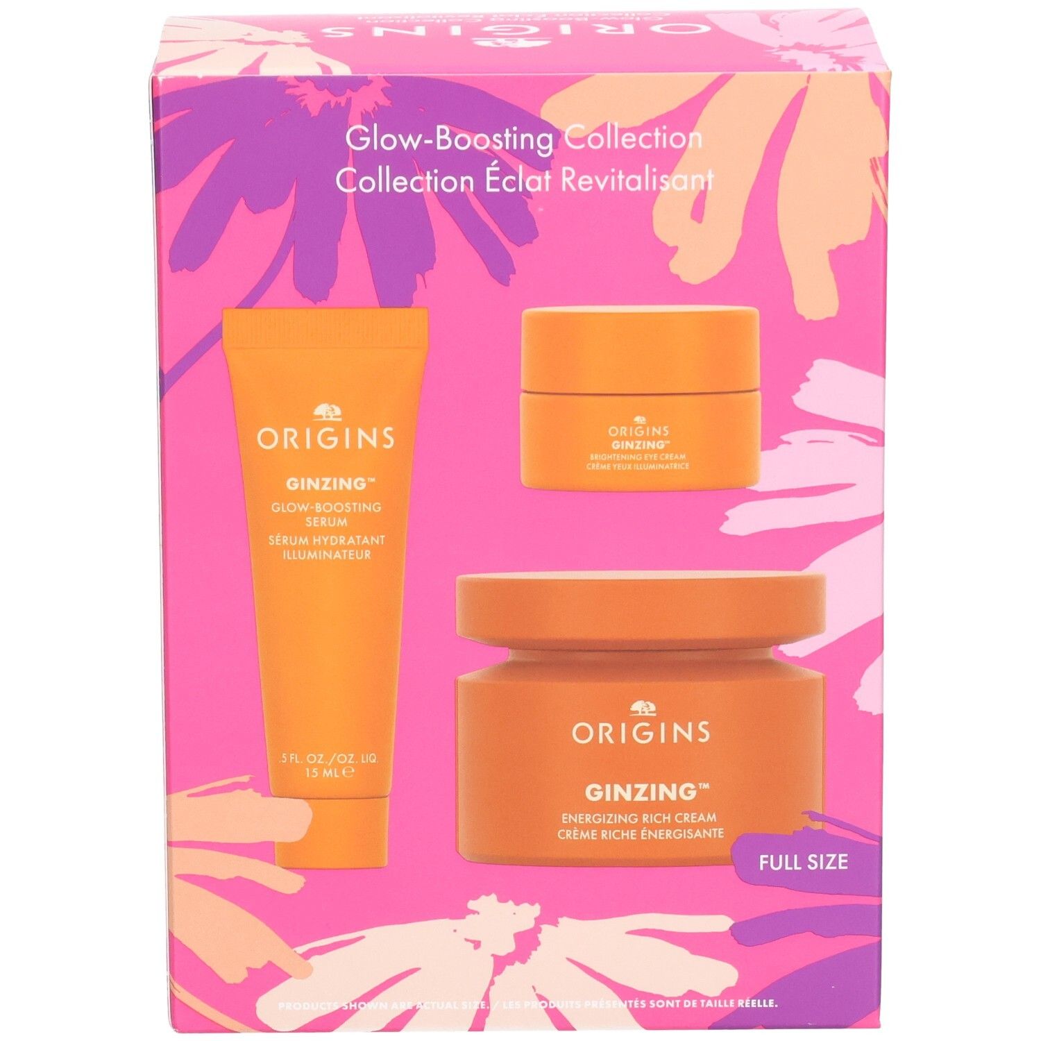 Cadeauset met drie oranje producten. Opschriften: Origins, Ginzing, Glow-Boosting Serum, Energizing Rich Cream. Verpakking met bloemenpatroon.