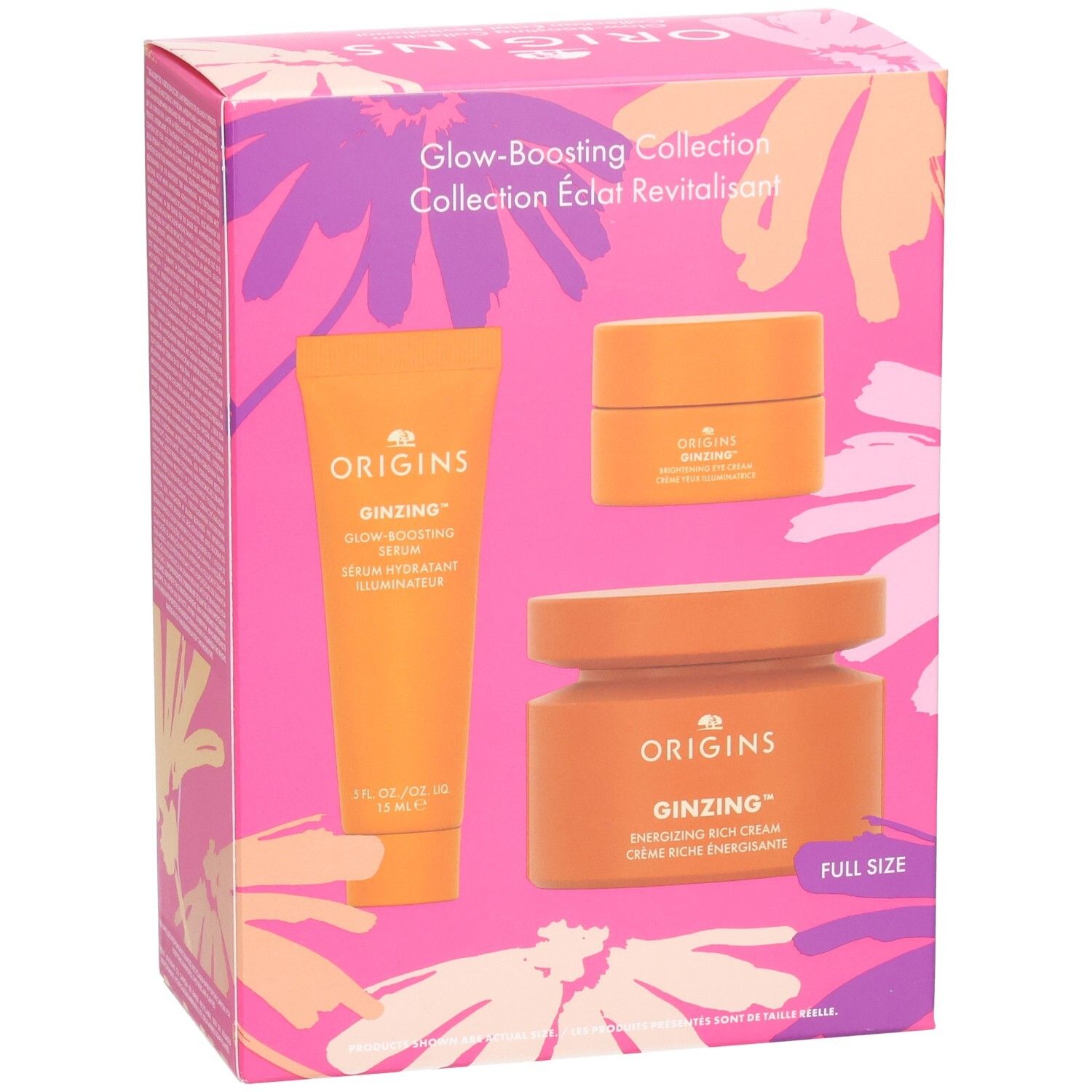 Cadeauset met drie oranje producten. Opschriften: Origins, Ginzing, Glow-Boosting Serum, Energizing Rich Cream. Verpakking met bloemenpatroon.