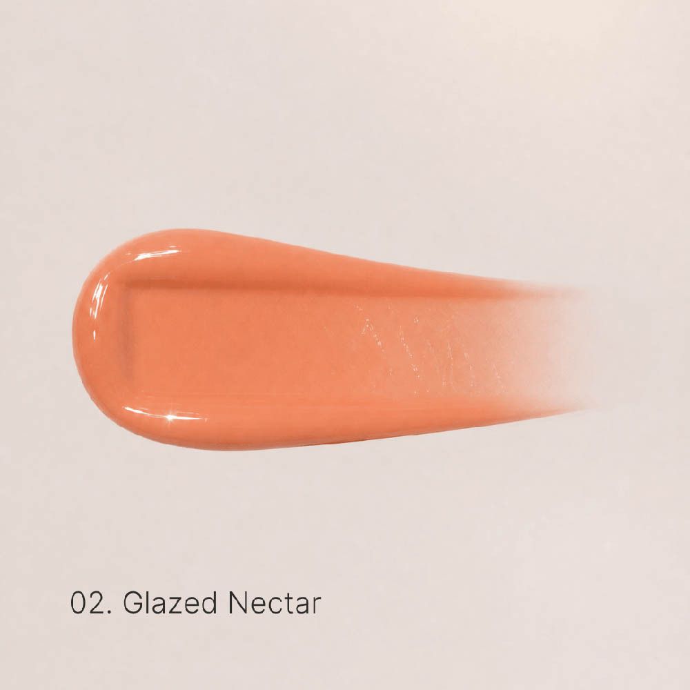 Applicatorflesje van Couleurs de Noir Peptide Lip Glaze 02 Glazed Nectar, geopend, met zichtbare applicator en verwijderde dop.