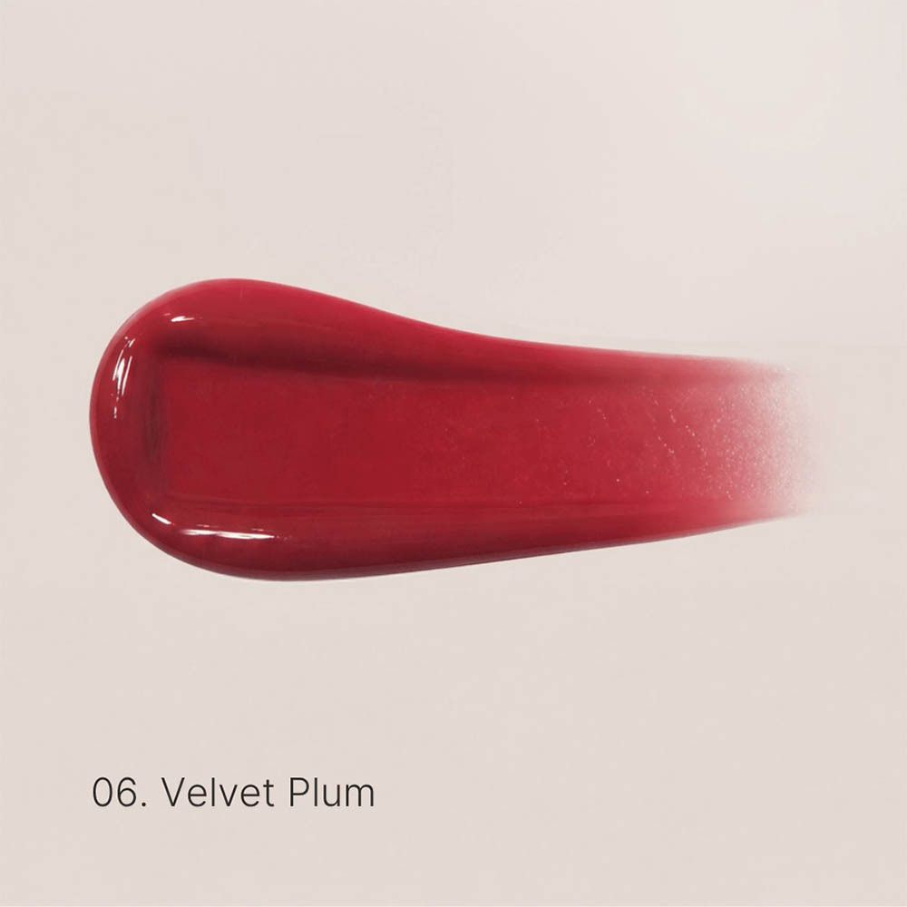 Tube van de Couleurs de Noir Peptide Lip Glaze 06 Velvet Plum met dop eraf.