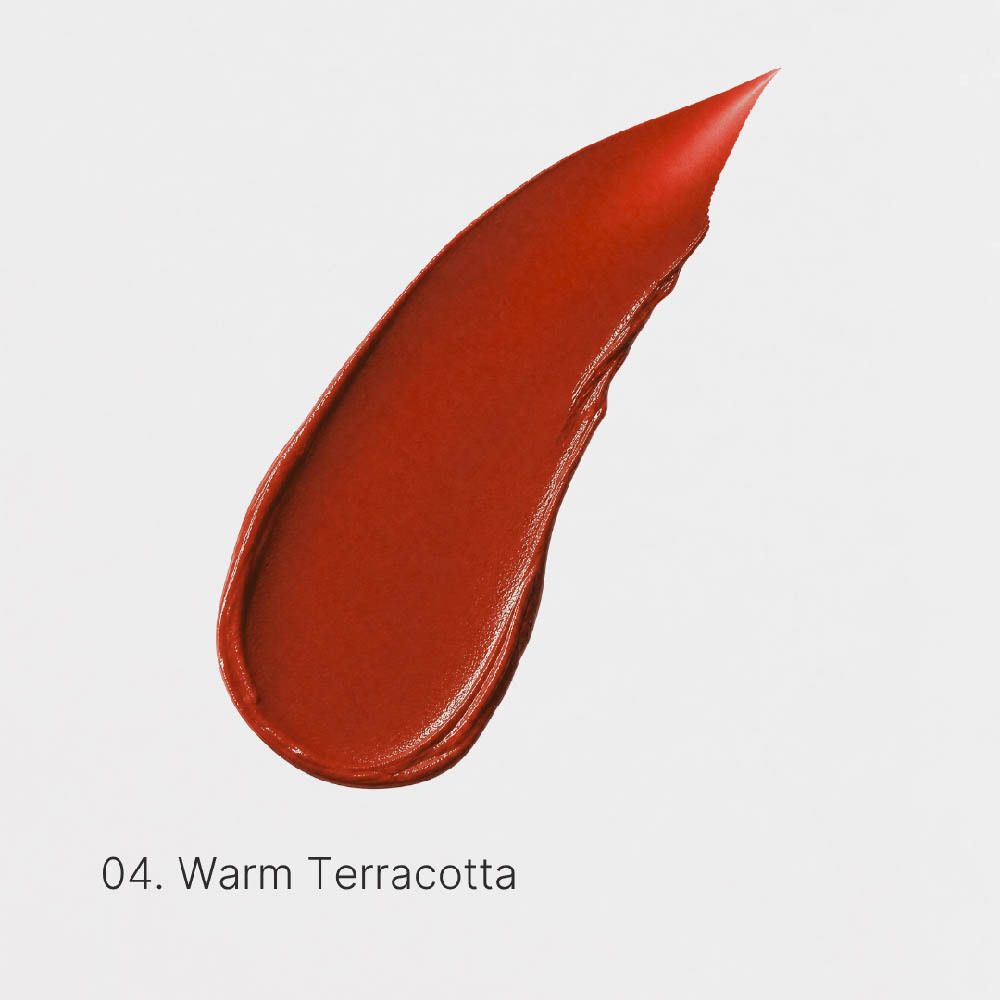 Rouge à lèvres noir et son capuchon côte à côte, teinte 04 Warm Terracotta.