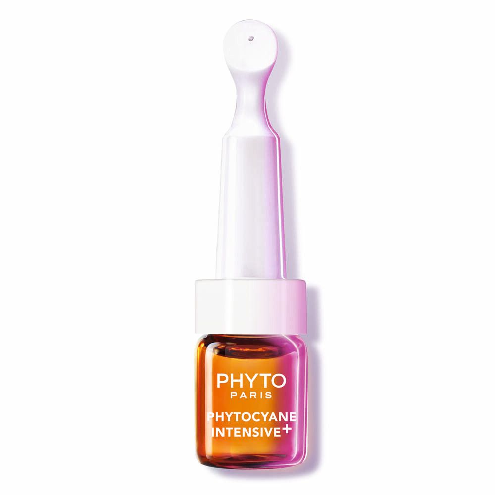 Kleine Phyto Paris ampul met goudkleurig serum en witte applicator.