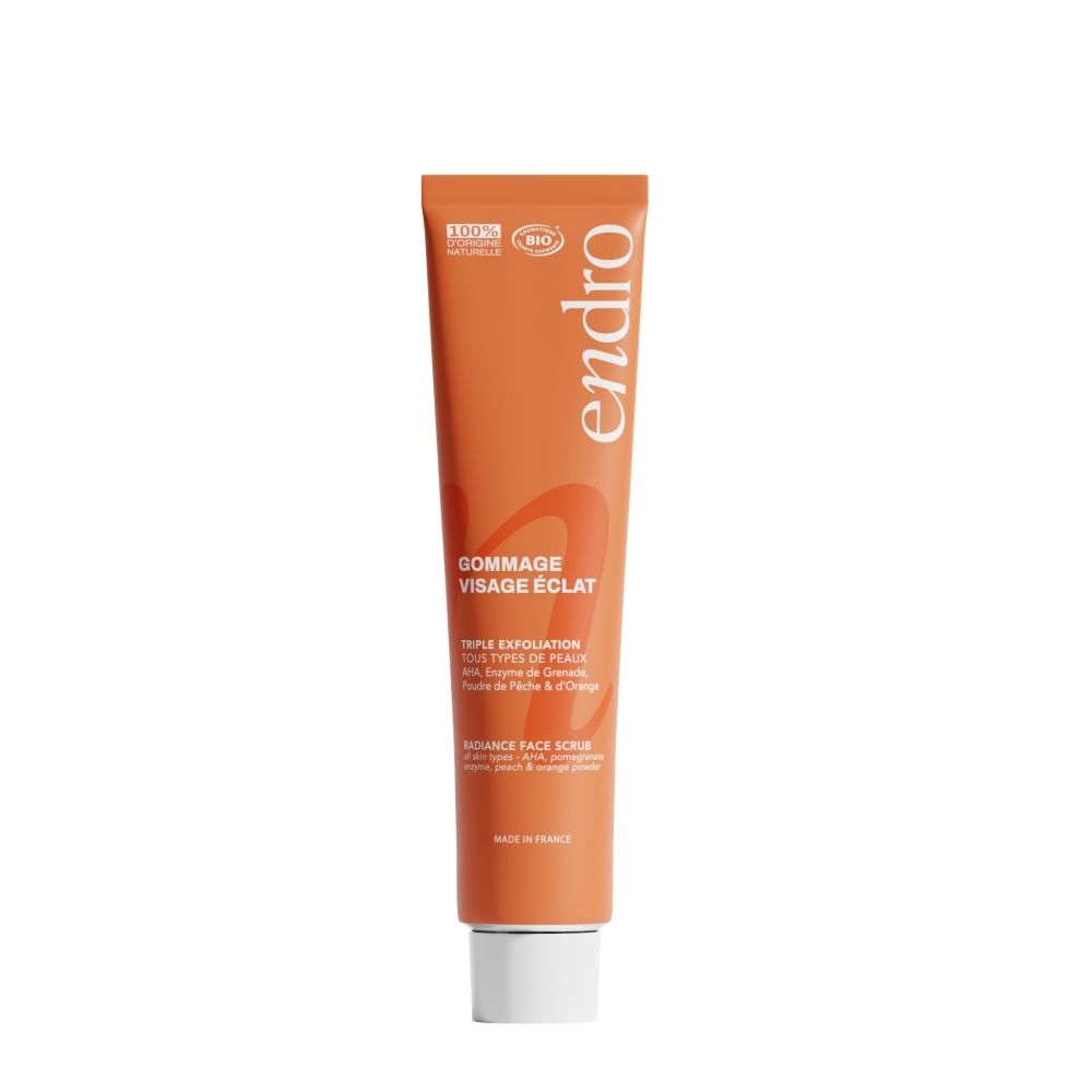 Oranje tube met Endro logo en 'Gommage Visage Éclat' opschrift. 100% natuurlijke ingrediënten.