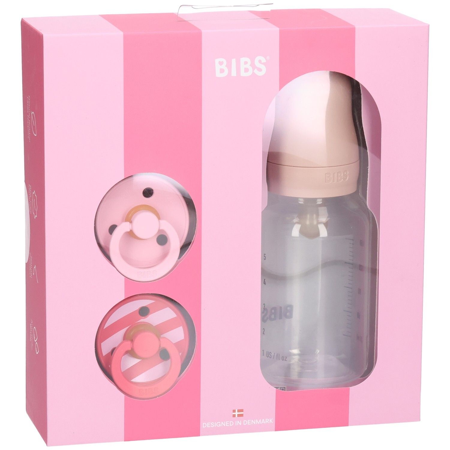 Roze geschenkverpakking met fopspenen en fles. BIBS-logo. Transparante fles met schaalverdeling. Twee spenen.