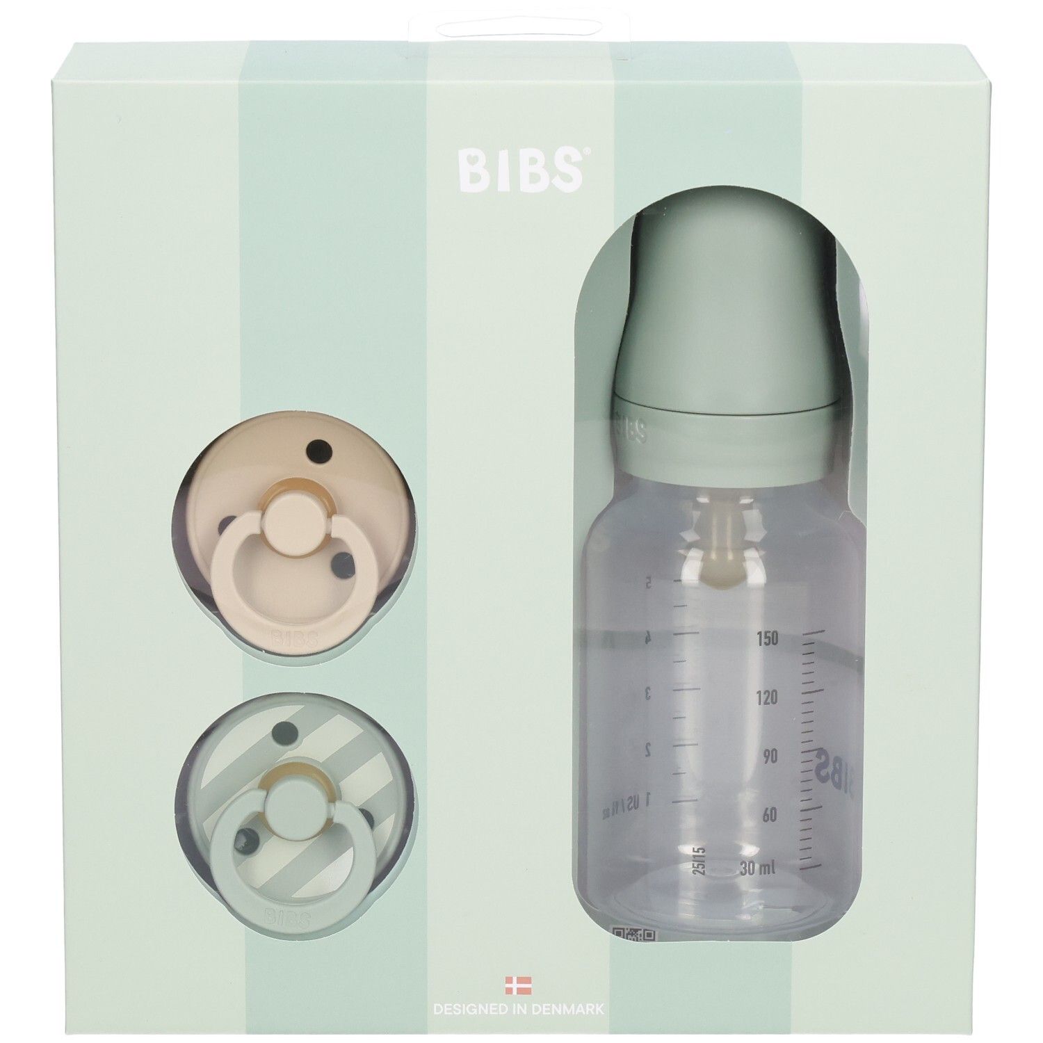 Cadeauset met twee fopspenen en een babyfles in een doos. De fles heeft een maatschaal.