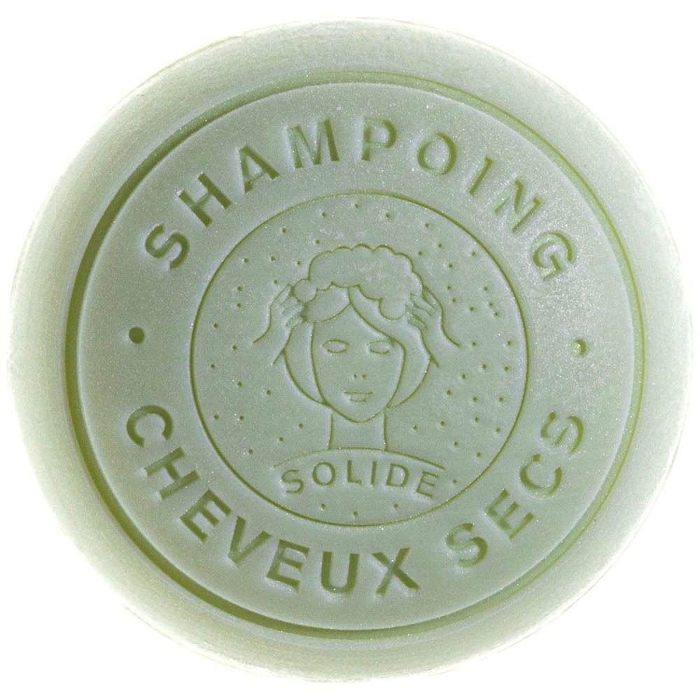 Groene vaste shampoo bar met reliëf: 'Shampoing Solide Cheveux Secs' en gestileerd gezicht.