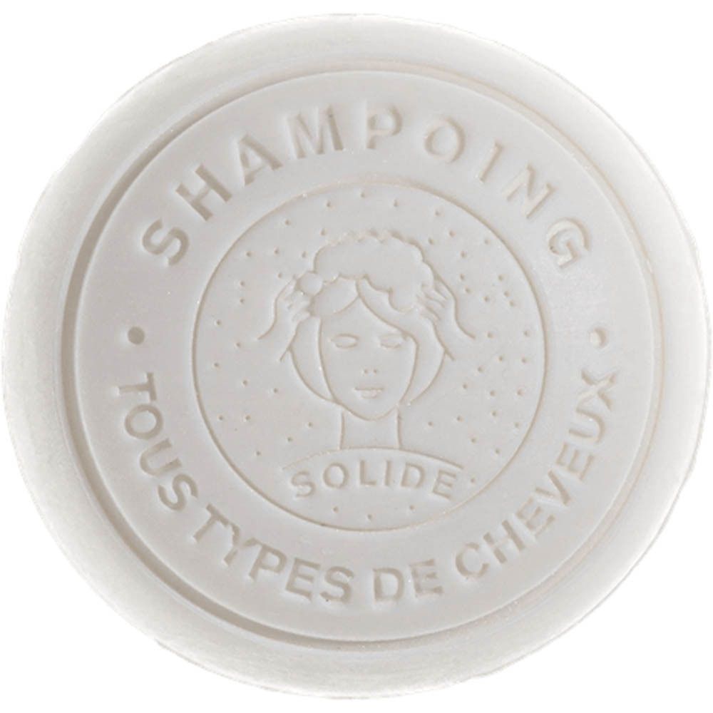 Ronde vaste shampoobalk met vrouwen gezicht en opschrift 'Shampoing Solide Tous Types de Cheveux'.