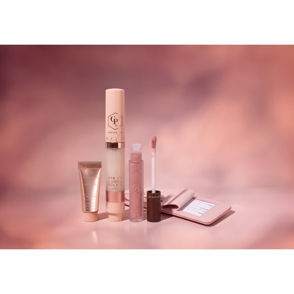 Cent Pur Cent SPF Essentials Box met zonnebrandcrème, lippenstift en spiegel.