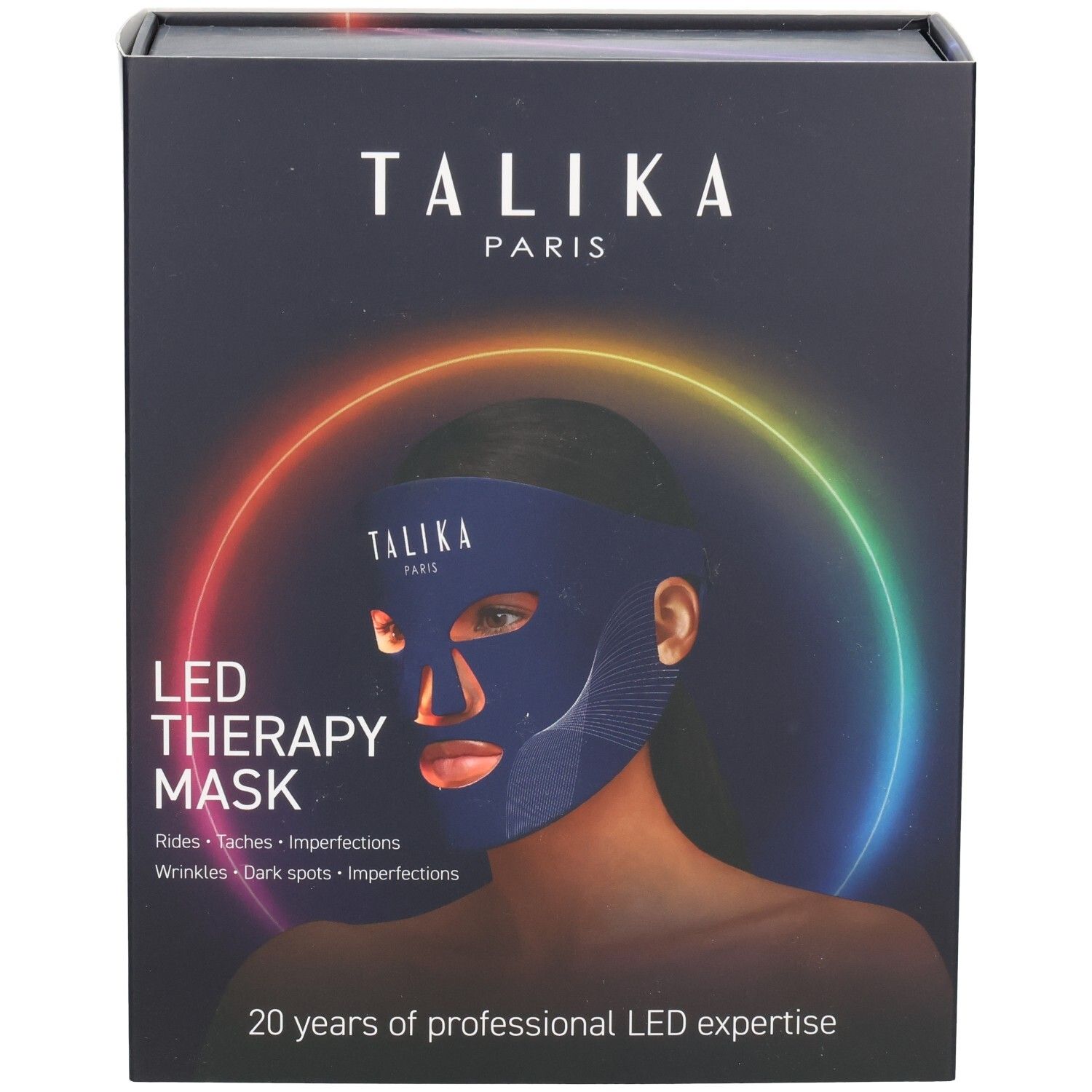 Emballage du masque Talika LED Therapy avec une femme portant le masque, entourée d'un cercle de lumière arc-en-ciel.