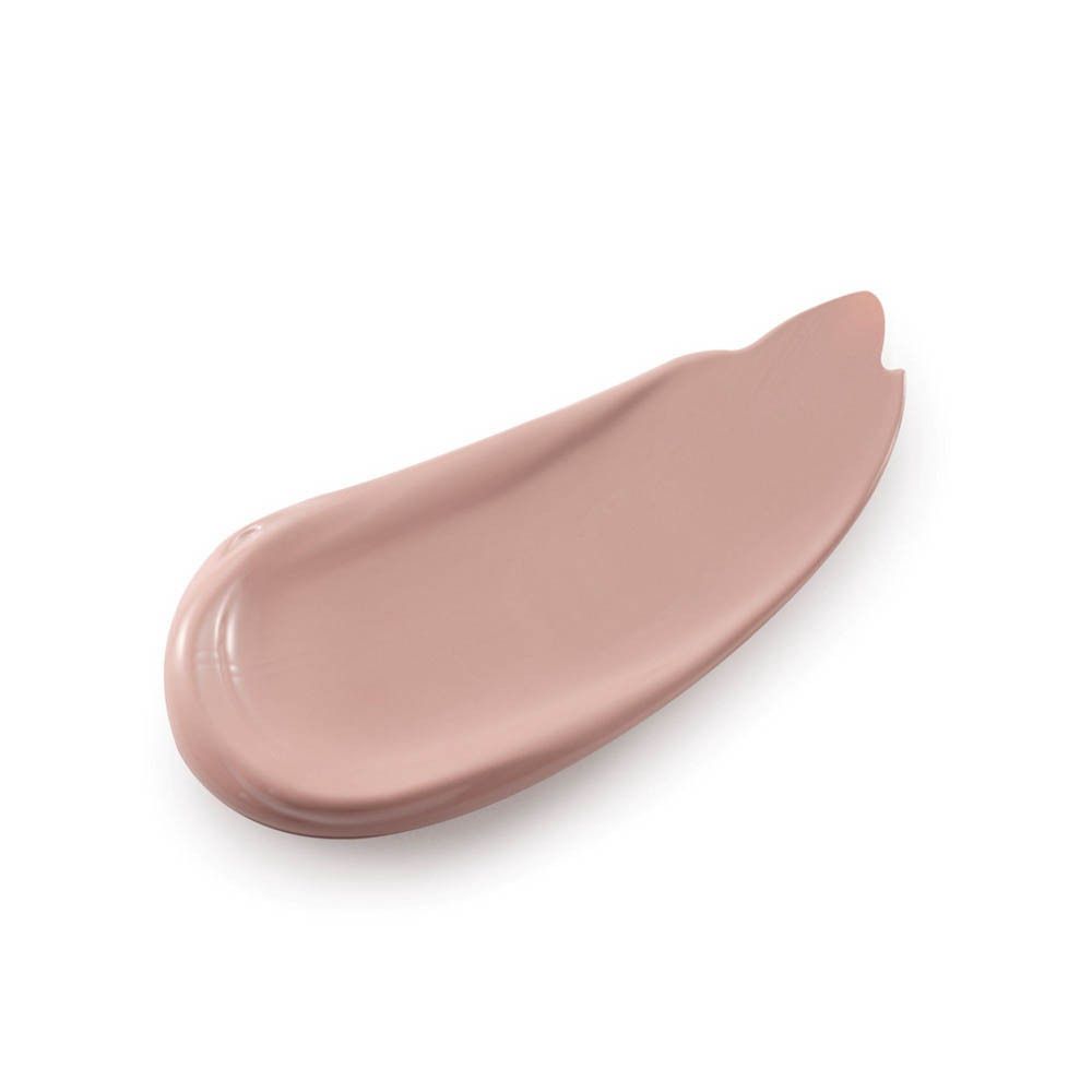 Une touche de fond de teint beige clair sur fond blanc.