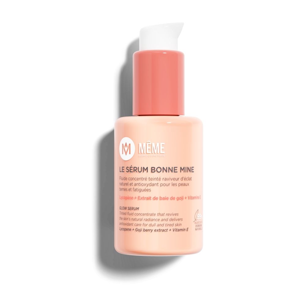 Flacon pompe beige avec bouchon rose. Contient 30 ml.