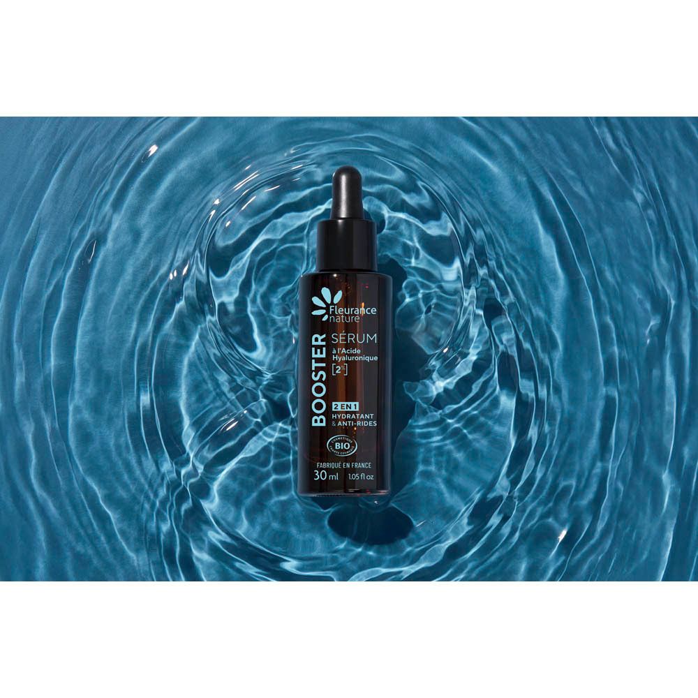 Bruine glazen fles met druppeldop, booster serum met hyaluronzuur.