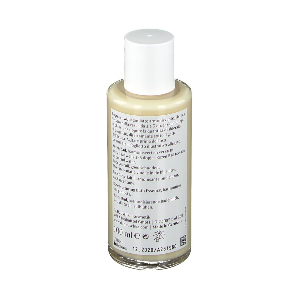 Glazen fles met witte dop. Etiket met tekst en rode streep. Achterkant met tekst.