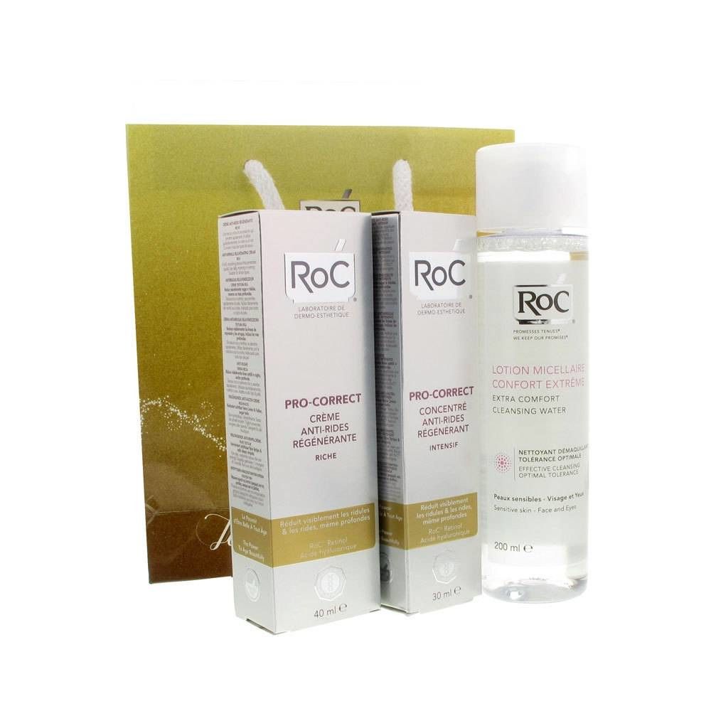 Coffret cadeau Roc. Comprend des crèmes, un concentré et de l'eau micellaire. Présenté avec un sac en papier doré.