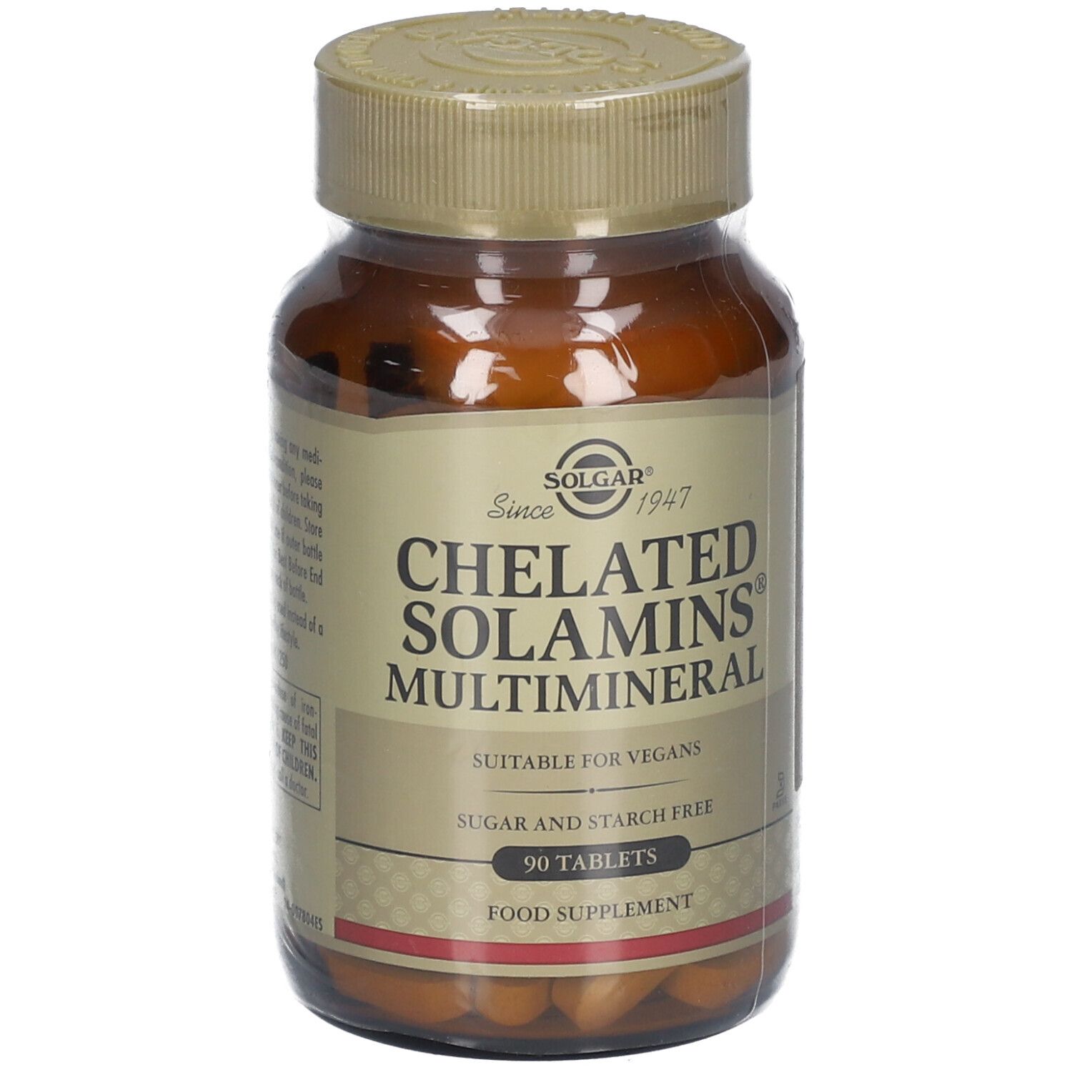 Bruine glazen fles Solgar Chelated Solamins Multimineral. Opschrift: 90 tabletten, geschikt voor veganisten. Close-up.