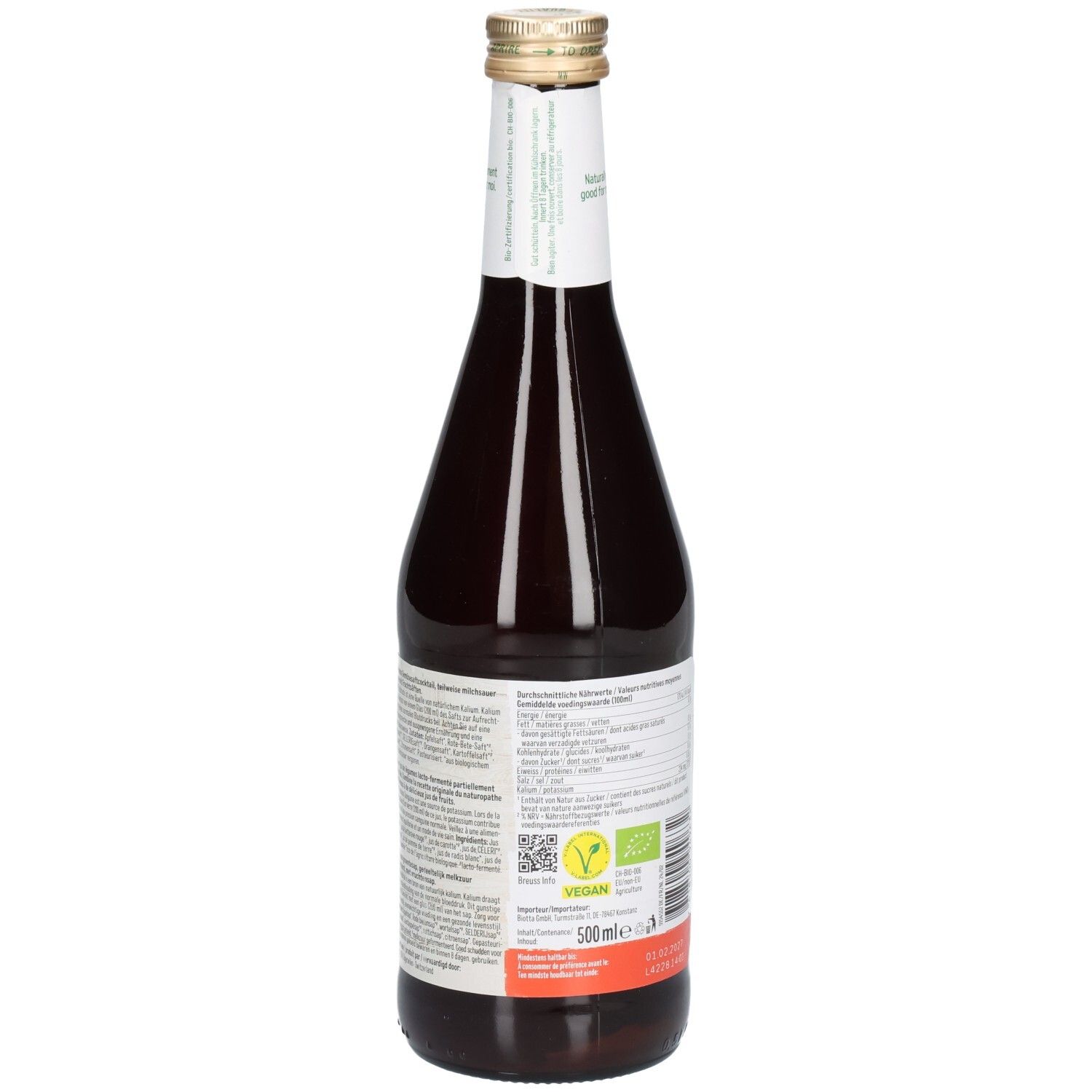Achteraanzicht van de glazen fles. Etiket met ingrediënten, voedingswaarden en veganistisch keurmerk. Bio-keurmerk.