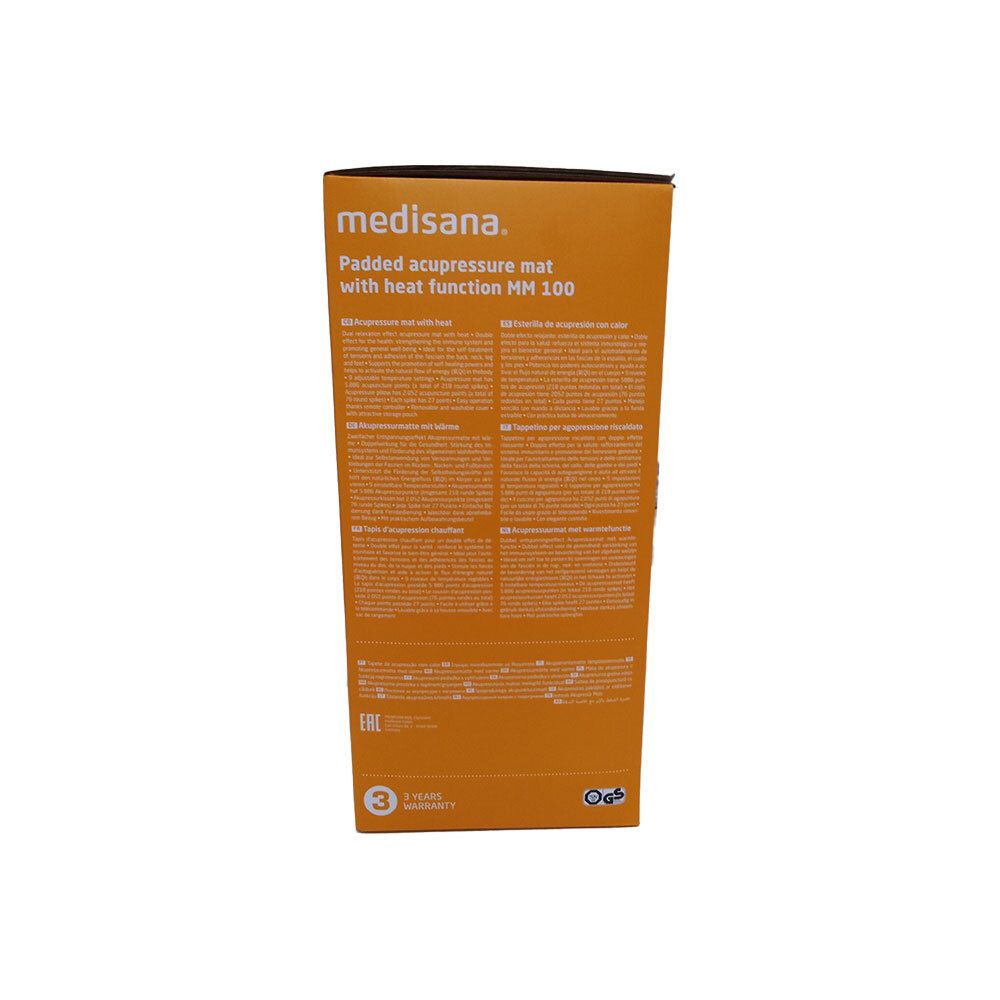 Dos de l'emballage Medisana MM 100 Massagemat 1st. Nom et description du produit. Informations de garantie. Texte multilingue.