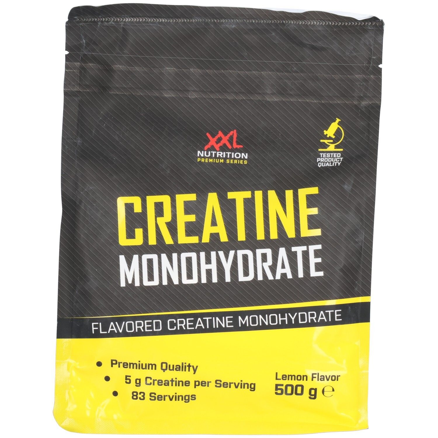 Zwarte verpakking met gele tekst. 'Creatine Monohydrate' en 'XXL Nutrition' zichtbaar. 500 g, citroensmaak.