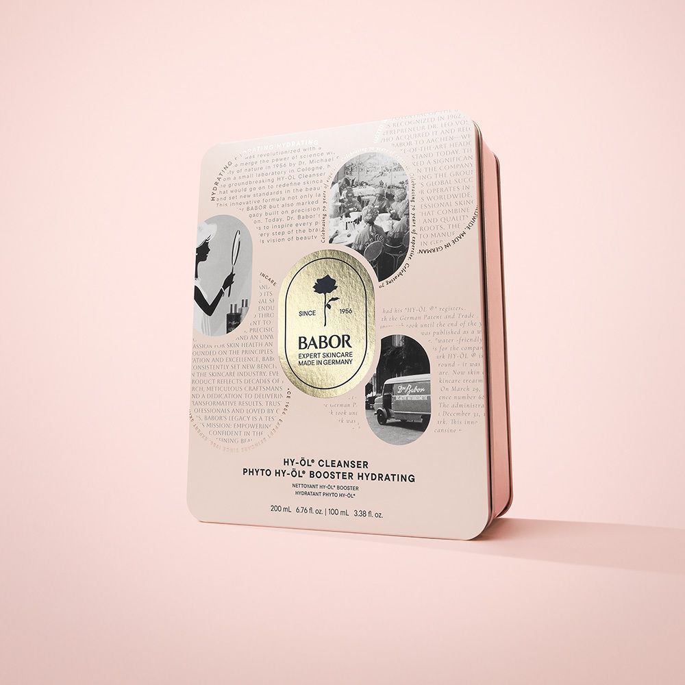 Coffret cadeau avec emballage. Emballage avec texte et logo : Babor, rose. Texte : HY-ÖL® Cleanser, Phyto HY-ÖL® Booster Hydrating.