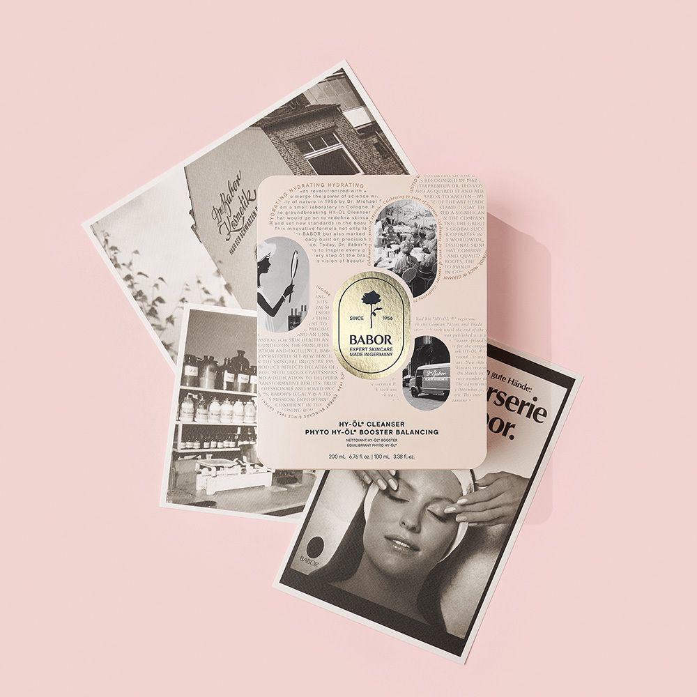 Boîte métallique, vue oblique latérale. Logo rose et texte BABOR. Texte : HY-ÖL® Cleanser, Phyto HY-ÖL® Booster Balancing.