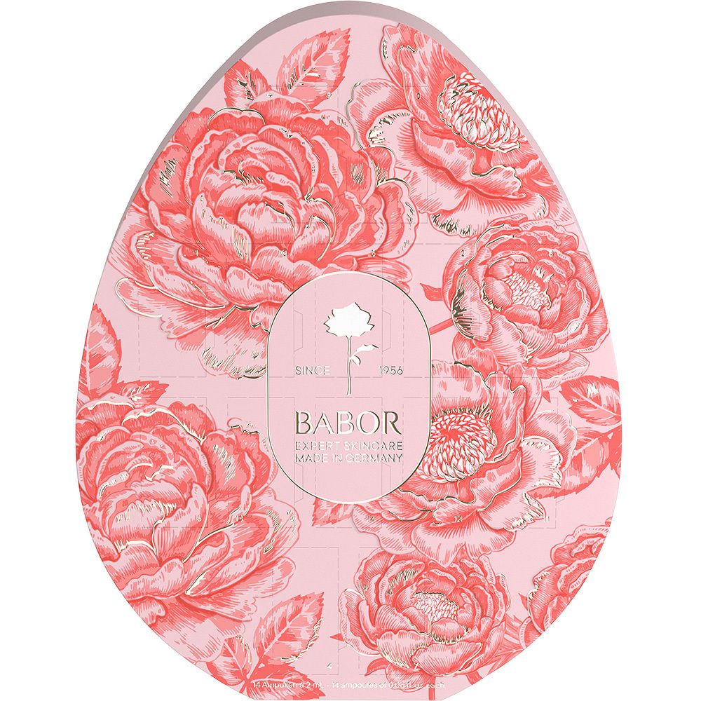 Emballage en forme d'œuf avec motif floral et logo Babor. Fond rose, détails dorés. Texte "Made in Germany".