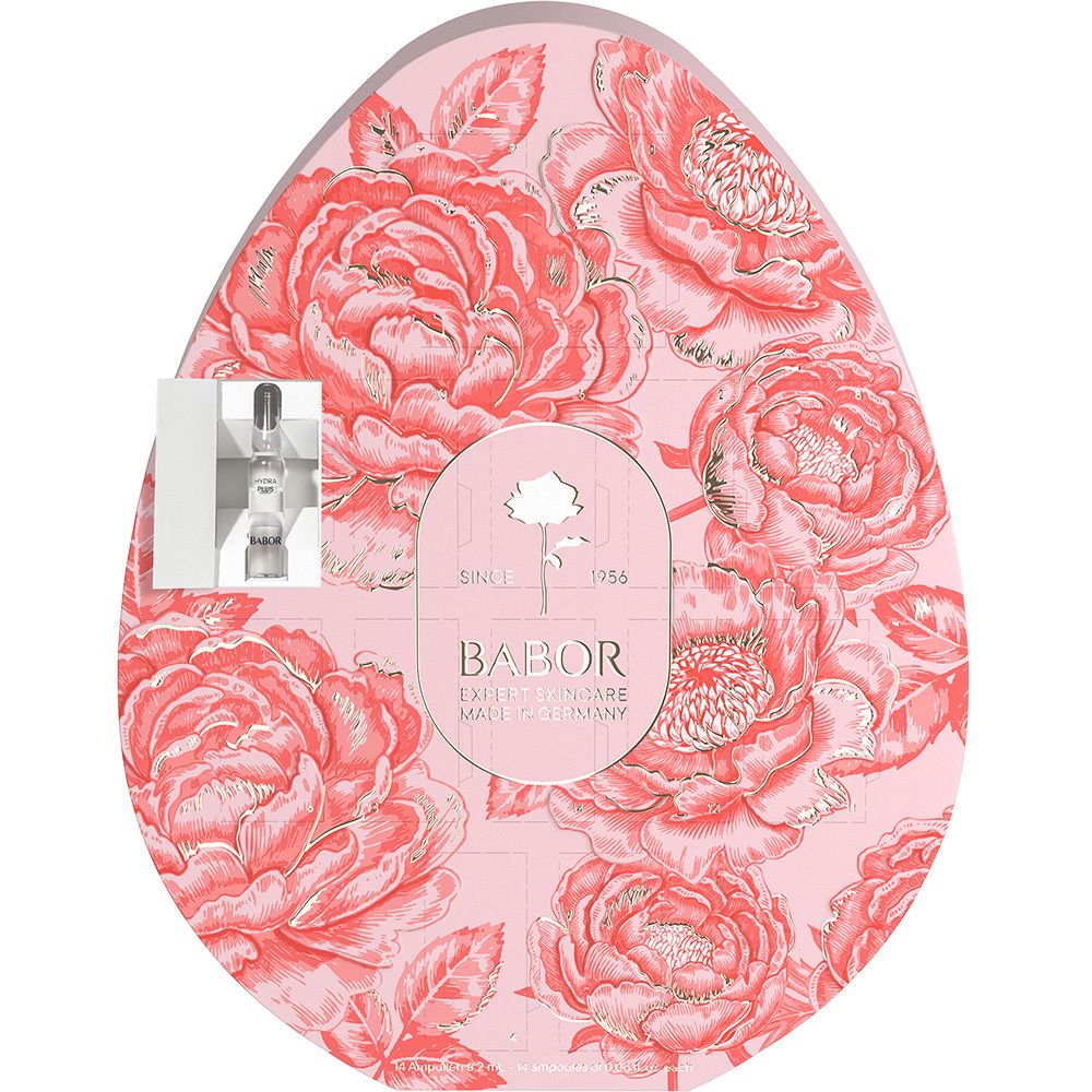 Emballage en forme d'œuf avec motif floral et logo Babor. Fond rose, détails dorés. Ampoule visible.