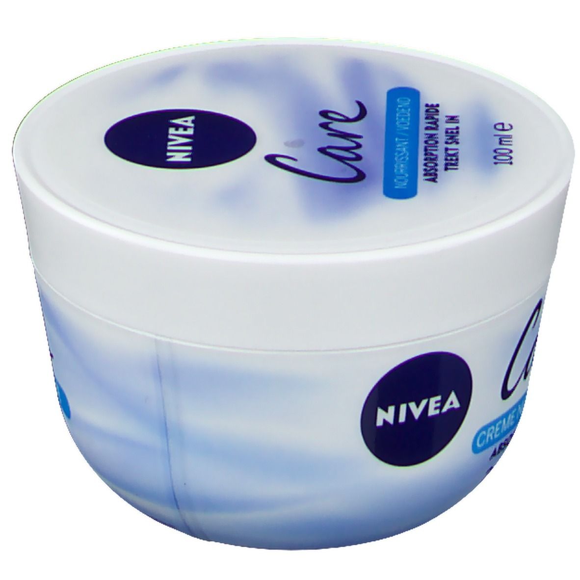 Pot blanc avec couvercle bleu. Inscription: NIVEA Care, Crème Nourrissante, 100 ml.